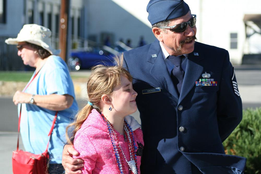 Loyal Knight, Greg Gonzales and his granddaughter enjoying the parade