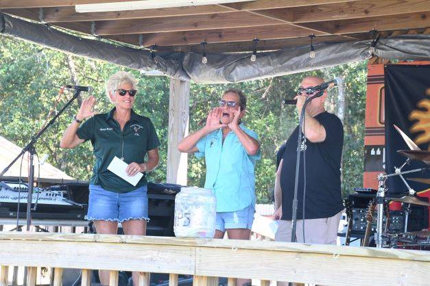 Lodge bartender Jean Maddox and board member Cheryl Royal present a check for $1,950 to the Barnabus fund. These monies were raised during the Christmas in July event.