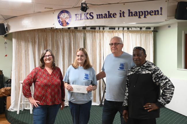 Al Williams and Tracy Carroll presenting a check for $1,783 to Ken & Theresa Heselschwerdt of the Green Cove Springs Food Pantry.