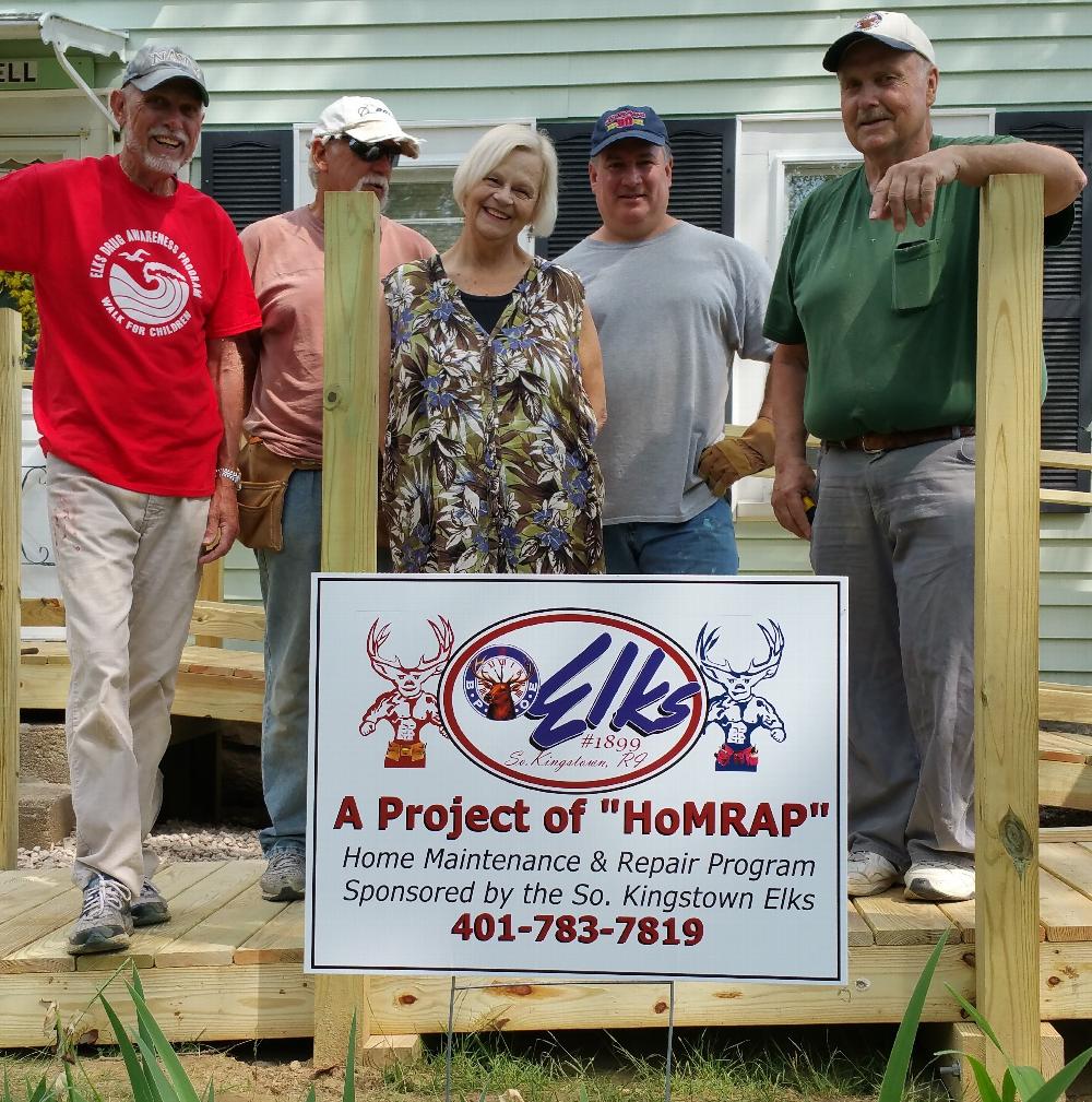 Elks Project Crew with homeowner during construction of wheelchair ramp.
