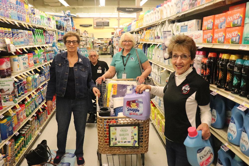  Members of the Aurora Lodge #1921 participated in the Grocery Cart Race in March to help the Mile High Care Comitis Center presenting them with a very timely gift of $1,500.00 Gratitude Grant to help them replenish their frozen foods which were due to a power outage during the recent blizzard.  Pictured are ER Richard Guerrero, ENF Chairperson Arliss Guerrero, Lodge member Beverly Findlay and Comitis representative Candace Larue
