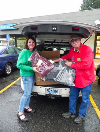 PER/Grant Coordinator Walter Kauhn presented Sarah Suhrstedt, Counselor & Education Assistant at Days Creek Charter School, with over 40 "Keep-A-Teen Warm" items purchased with BEACON Grant funds.