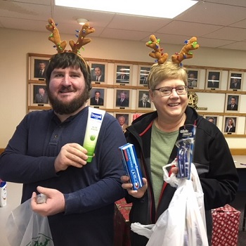 Shown here with a few of the many generous donations on December 15, 2018 are Pierre Elks Lodge Leading Knight Jonathon Ward and Karen Pogany. 