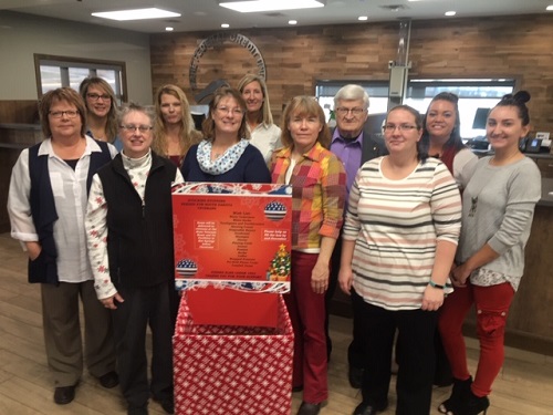 Pierre Elks Lodge Members and Oahe Federal Credit Union Employees pose for a photo to promote the 2018 Elks Stocking Stuffer Program for veterans.