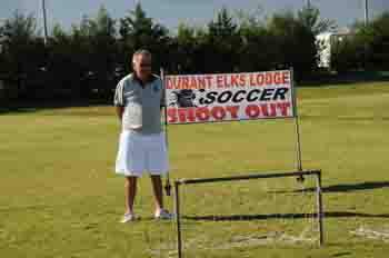 Elks brother Jerry Mowles makes ready to start shagging the soccer balls from local youth competing in the annual Elks Lodge 1963 Soccer Shootout!