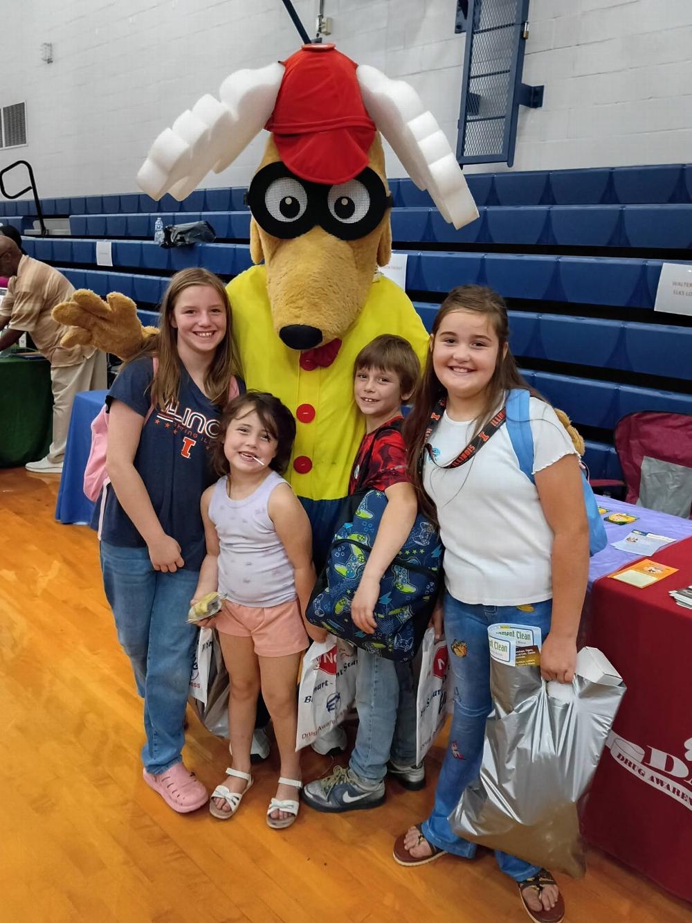 On August 1st the Walterboro Elks Lodge #1988 was at the Colleton County Highschool for their Back to School Bash. Our ER; Mary Jo, Leading Knight; Angus and 2-year Trustee Ernest, handed out coloring books, crayons and drug awareness literature. Elroy showed up and was received by some very happy kids of all ages. Angus spoke to the crowd about our Hoop Shoot contest. This is just one of the many community events our Lodge represents.