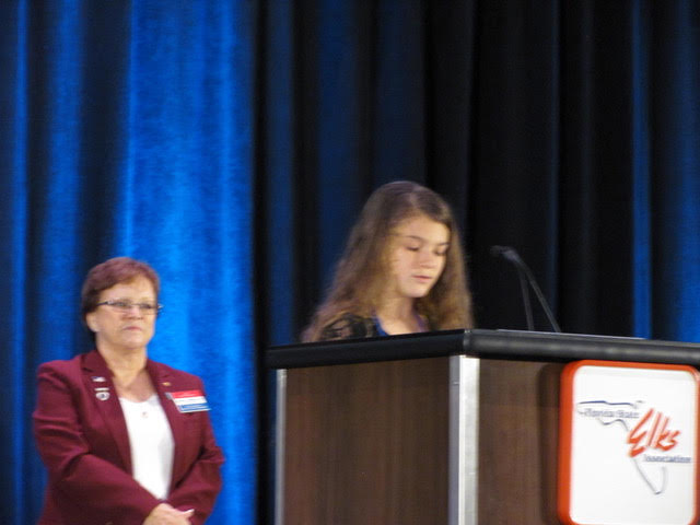 Teagen Constantini the first place State winner for the Americanism Essay Contest reading her essay at FEA convention.  She was sponsored by the Naples Lodge and attends St Ann’s Catholic School.
