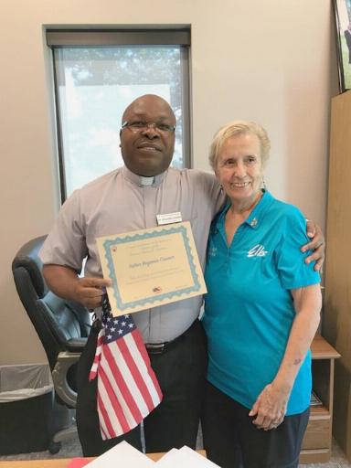 Anna Marie Honan, Lodge Americanism Chair presenting a new Citizen Award to Fr. Benjamin Casmir.  A Flag to comment the day and a Flag pin was also awarded. Award took place on 09/11/19 at St Peter the Apostle Church in Naples.
