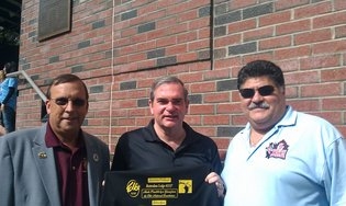 PER John Gosch and Pedro Rosa present an Autism volunteer t-shirt to Schenectady Mayor Gary McCarthy. 