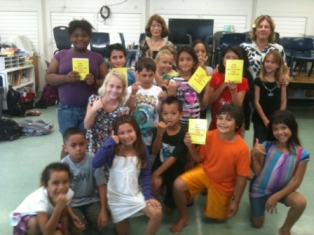 Lani, Maile and Sharon present dictionaires