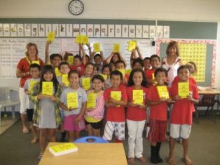 Maile presents Elks Dictionaries to students