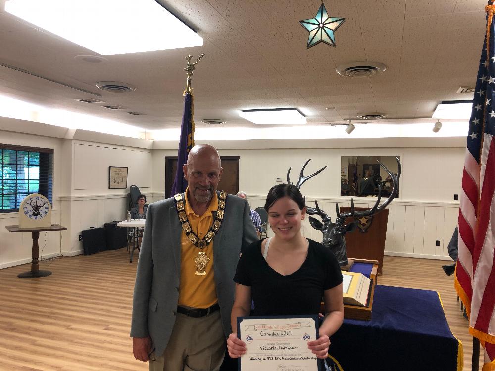New York State Scholarship recipient Victoria Holzhauer is pictured with Exalted Ruler Jay Mason as he presents her with a Certificate of recognition. 