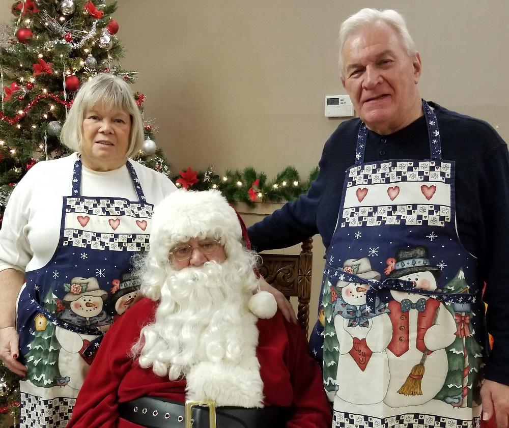 December 2018 - Members Stan and Cheryl Chesneski are shown with Santa during breakfast with Santa. In addition to an excellent breakfast, children have an opportunity to tell Santa what they want for Christmas and receive a small gift. 12/18