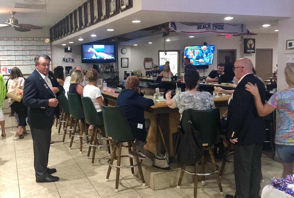 October 18, 2021: Celebrating the installation of 8 new members (one of the few occasions when we dress a bit more formally) and waiting for "Steak Night" to begin.