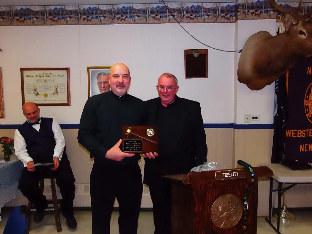 Bob Snover, PER, receives recognition plaque from Tom Steele, ER, for his service and leadership in 2016