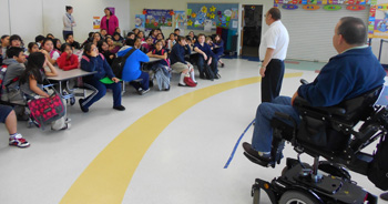 ER John and PER Steve speaking to Cornelius Elementary before presenting dictionarys.