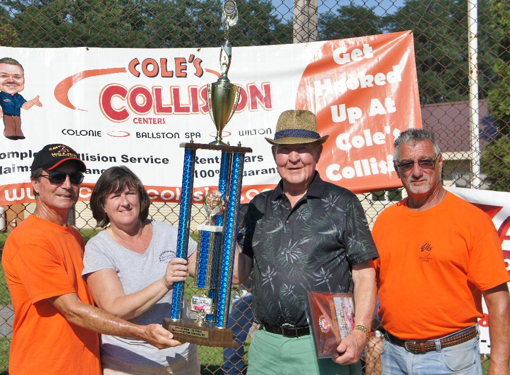 Dick Campion, ER Audrey Osterlitz, and Mike Bendetti award the First Place Trophy at the 2016 Car Show on August 20. The event was highly successful with over 150 vehicles registered.