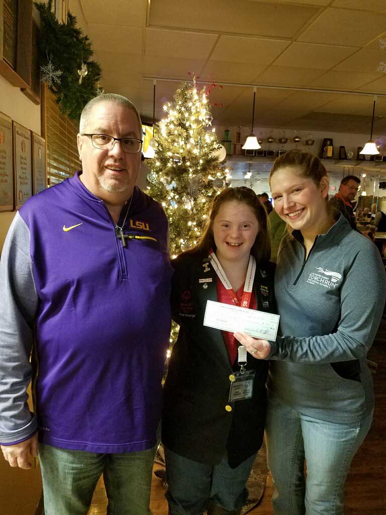 Donation to the Special Olympics by Jeff presented to Emmerson and Beth.