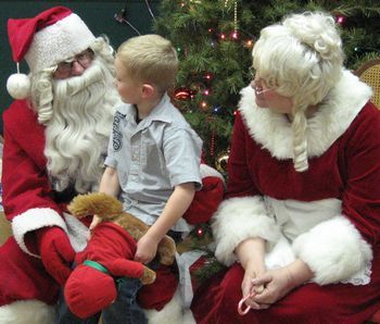 SAnta & Mrs. Clause with a young friend and newly created chipmunk