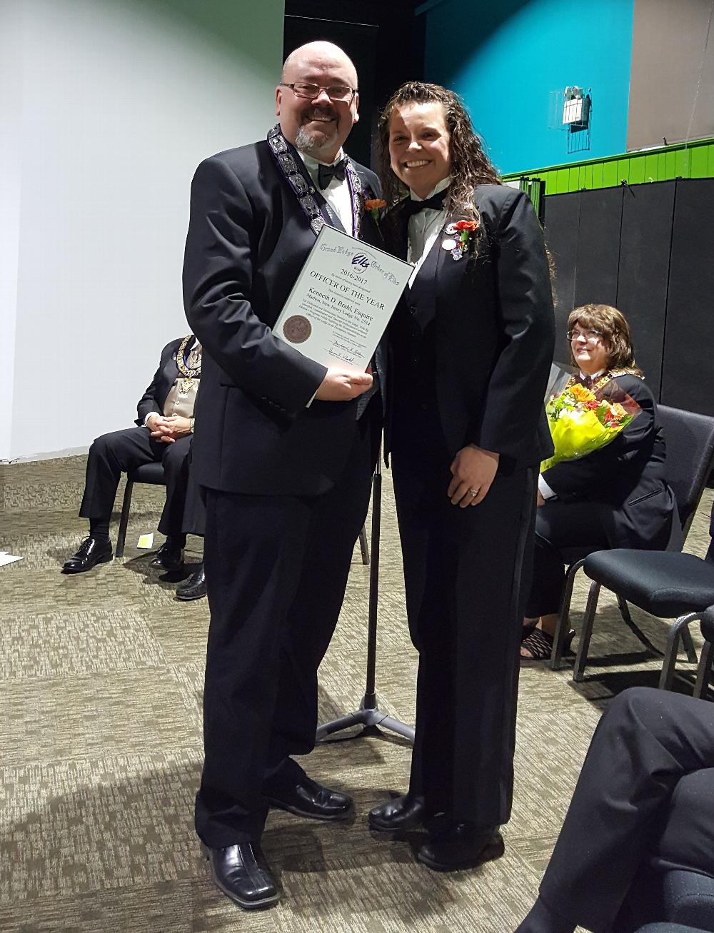 Ken Brahl receiving the Officer of the Year award for 2016-17 from Exalted Ruler Allison.