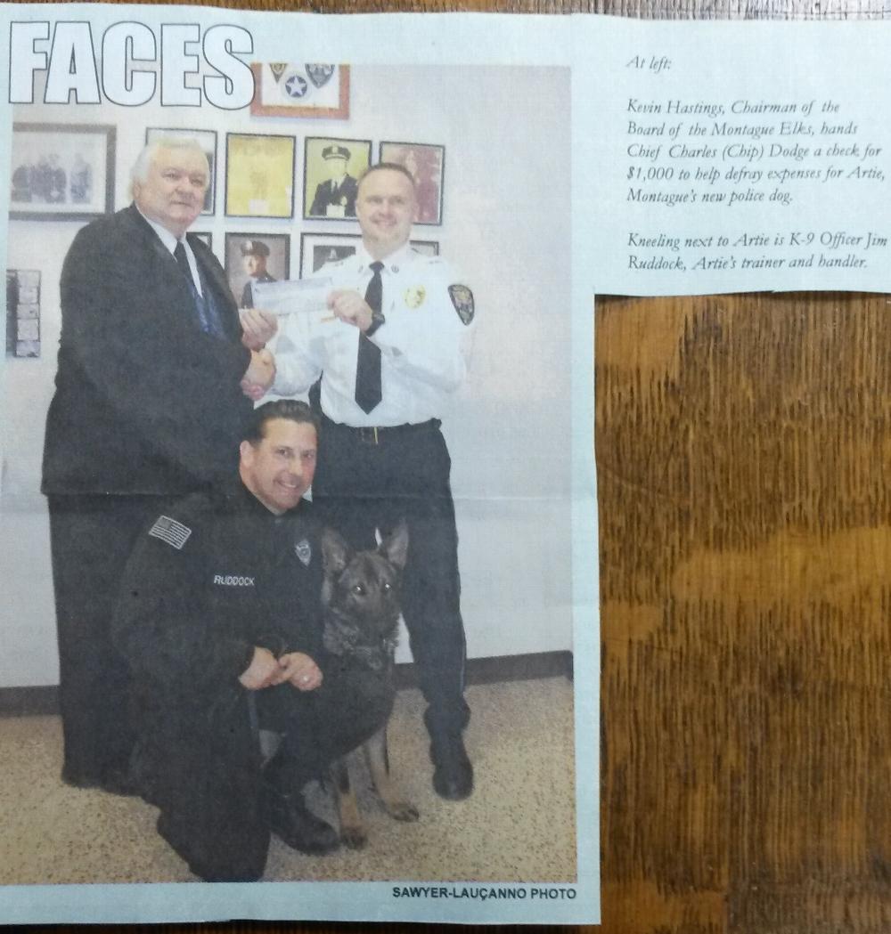 Chairmen of the Board Kevin Hastings presents Montague Police Chief with a check for $1,000 to help the Montague Police with K-9 Artie.  Also pictured is K-9 Artie and K-9 Officer Jim Ruddock.