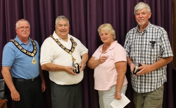 For the first time in Lodge history, two members of the Skowhegan-Madison Lodge earned the Grand Exalted Ruler's Award for proposing 11 or more candidates within a year. Past District Deputy Roy Bolton (left) presented watches to E.R. Ron Voisine (next to Bolton) and Randy Wright (right) at the Aug. 28, 2013 meeting. Also pictured is Donna Brown, who received a GER pin for proposing four new members. Charlie Guerin, who was unable to attend the meeting, also received a GER pin for proposing five new members.