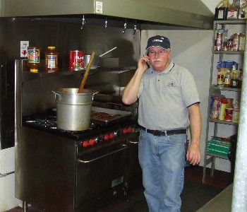 District Deputy Roy Bolton takes a short break from preparing his famous meatballs for the Nov. 30, 2007 lodge fund-raiser.