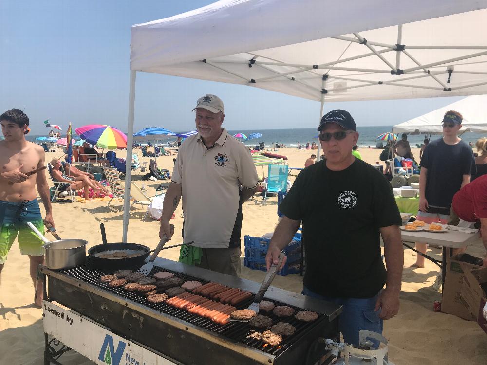 State President Ron Mangone and SED Deputy Ed Eglentowicz grilling at Camp Moore Day at the Manasquan Beach