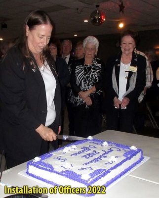 Exalted Ruler: Joanne Mayer cutting the cake.