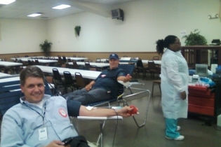 Members Peter Mason and Andy Gorman donating blood at the 2011 drive.