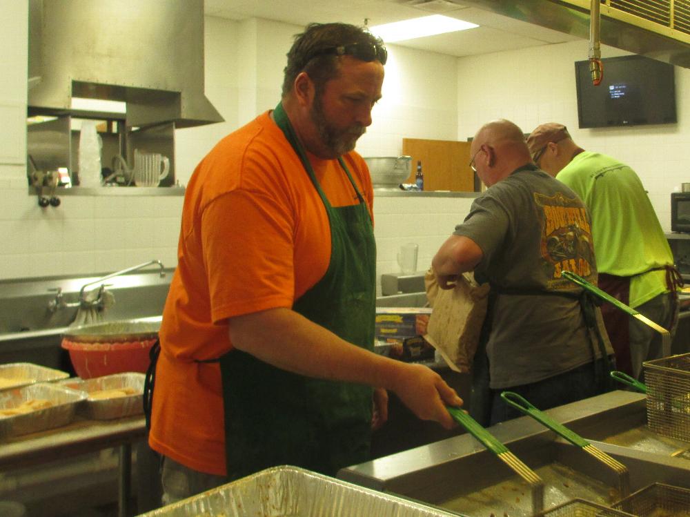 Dan Gokenbach frying fish