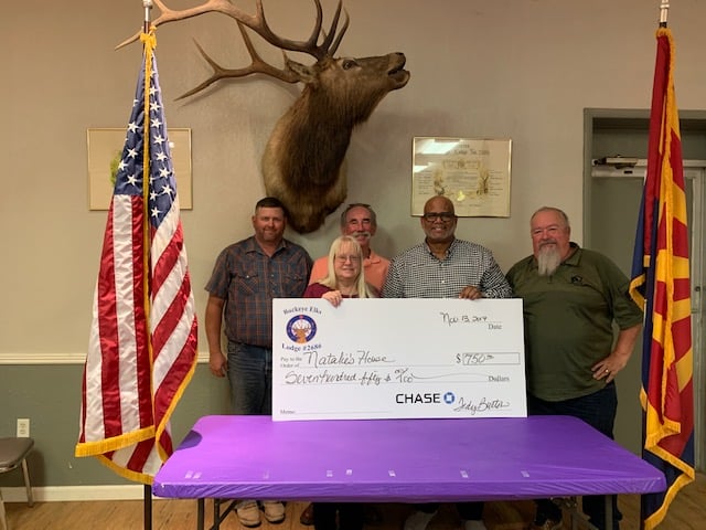 Thanks to the generosity of our Lodge Members and the Arizona Elks Major Projects, we were able to make a wonderful donation to Natalie's House! Pictured are Lodge Officers Eric Cooke, Jay Broadbent, Tedy Burton, and Steve Staudinger with Janet Olson of Natalie's House. Natalie's House is a group home for girls ages 6 to 16 who need help with all facets of life. Currently, they have girls there between ages 8 and 15. Their stays are approximately one year before moving on to a family member or a foster home. We also sent Janet off with a box of toiletries, toys and socks donated by PER Brian McAchran. Picture taken November 2019.