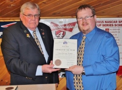 Trustee Lucas DeLong, right, was honored as 2015-16 Officer of the Year by Exalted Ruler Dennis Bragg.