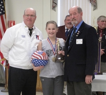 Peyton Grant of Newport won the Maine State Hoop Shoot championship in the girls’ age 12-13 division on Jan. 25, 2015 at the Augusta Elks Lodge. She now advances to the New England Regional round at Deering High School in Portland on March 28. Pictured, from left, are Maine North Hoop Shoot Chairman Shawn Stacey, Peyton and State President Tom Callahan.