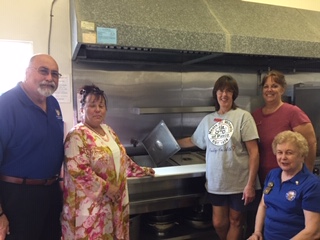 L-R: David Moyer, Exalted Ruler, Zephyrhills Elks Lodge 2731; Beth Aker, Executive Director, East Pasco Meals on Wheels;Tracy Stock, Coordinator and Cook; Leanne Starcher, Pantry Coordinator; (Seated) Judy Osgood, ENF Chairman Zephyrhills Elks Lodge 2731.

The ENF Gratitude Grant for East Pasco Meals on Wheels purchased a give compartment steam table with pans and lids and two new floor mats for the entrance doors. Items were needed for safety for the volunteers who  help prepare meals and load into vehicles for delivery to the elderly clients. 