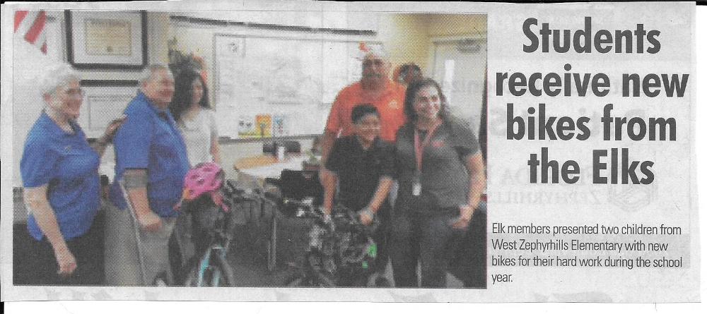 Elk members presented two children from West Zephyrhills Elementary with new bikes for their hard work during the school year. 