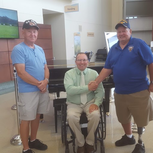 Pictured left to right: Ron Ellison, lodge member, Geoff Hopkins Chief of Recreation Service James A. Haley, Ken Fabiani P.E.R. Donation of $250 to Therapy Services.