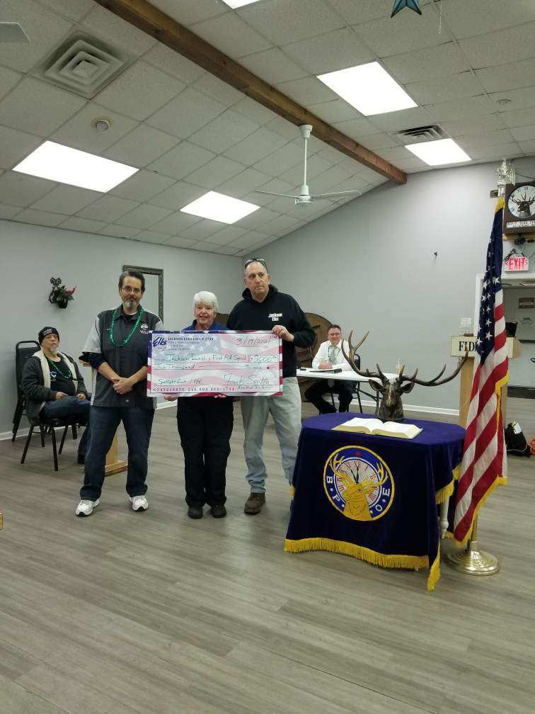 Joe LaMonica (left) and Frank Scotto (right) present Jackson Township EMS representative (center) with check for charitable donation  |  March 17, 2021