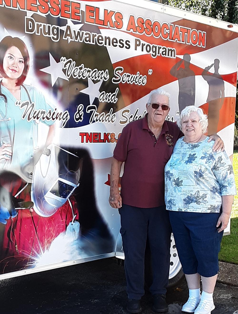 Trustee Ken Apley and wife, Nola Apley our treasurer stand next to the new "Drug Trailer" at the Mid Year Convention.