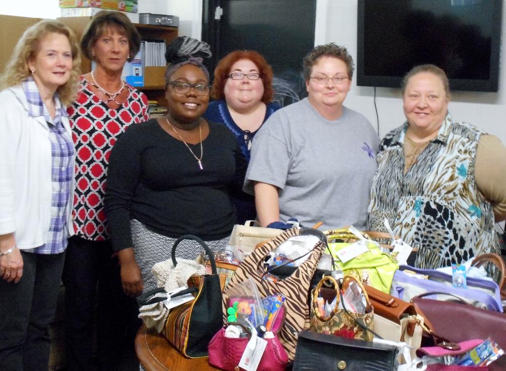 Bedford Lodge delivering completed Handbags of Hope to Bedford Domestic Violence