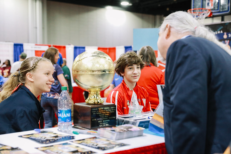 2022 Getty Powell winners Bree Besonen and Brandon Smith signed autographs at the Hoop Shoot Booth.