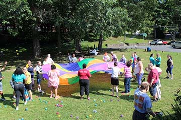 picture of campers with colorful parachute